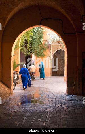 People in a courtyard on a house in Marrakesh, Morocco Stock Photo