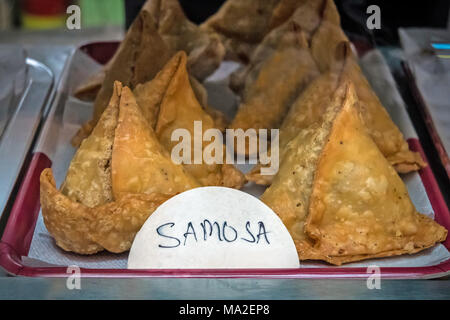 Deep Fried Samosa. Traditional Indian pie on the counter in the store. Stock Photo
