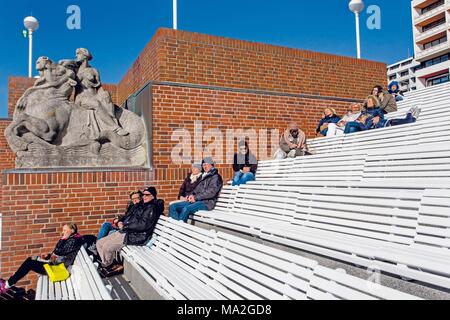 Holidaymakers sitting on the promenade in Westerland, Sylt Stock Photo