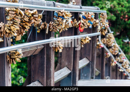Hundreds of love locks hanging on a bridge in Venice Stock Photo