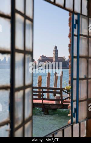 A view through the window of the glass blowing factory towards Cannaregio on the island of Murano near Venice, Italy Stock Photo