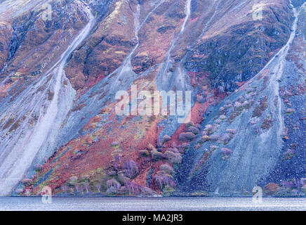 Trees clinging to the Screes – the steep slopes on the south-eastern side of Wast Water, Cumbria, England Stock Photo