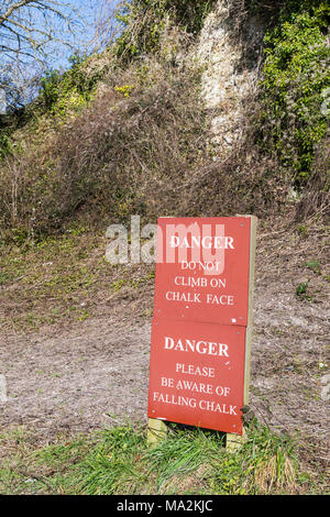 Beware of falling rock warning sign with triangle picture and alert ...