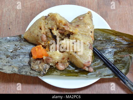 sticky rice steam with pork and salt egg in banana leaf of Chinese Duanwu festival Stock Photo