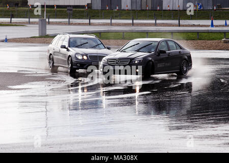 Mercedes C63 AMG on the skid pan at Mercedes-Benz World, Brooklands in Weybridge, England. Stock Photo