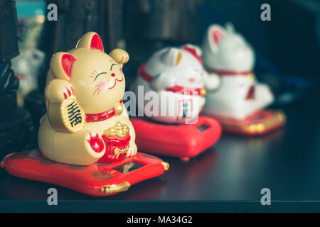 Maneki Neko Japanese lucky cat figures Stock Photo