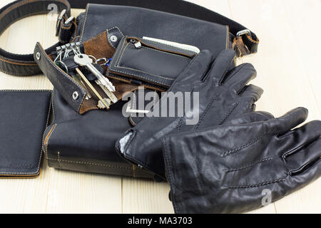 A set of leather goods, a bag, a key case, a document cover, a wallet purse, gloves, a watch Stock Photo