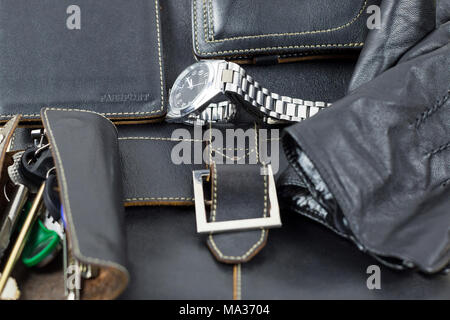 A set of leather goods, a bag, a key case, a document cover, a wallet purse, gloves, a watch Stock Photo