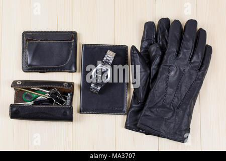 A set of leather goods, a bag, a key case, a document cover, a wallet purse, gloves, a watch Stock Photo