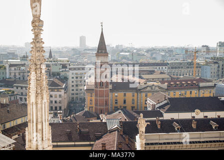 Milan, Italy panorama. View from Roof of Milan Cathedral Duomo. Bell Tower in Saint Gottardo in Corte. Stock Photo