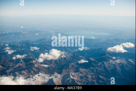 Dolomites Alps - Italy Mountains Under Clouds. View from Airplane. Stock Photo