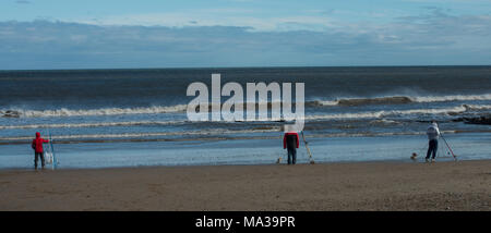 Sea fishing with rod and line from the beach at Seaham, County Durham on the North East coast of the UK Stock Photo
