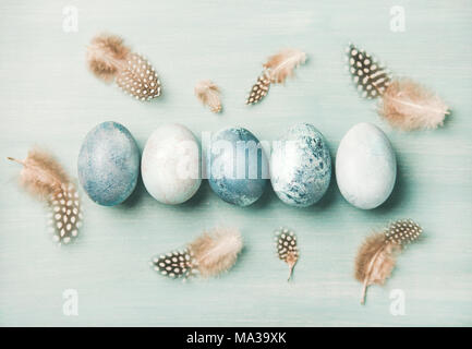 Painted traditional eggs for Easter holiday with feathers, horizontal composition