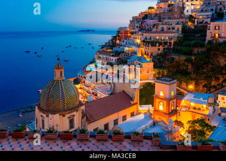 Positano, Amalfi Coast, Campania, Sorrento, Italy. View of the town and seaside in a summer sunset Stock Photo
