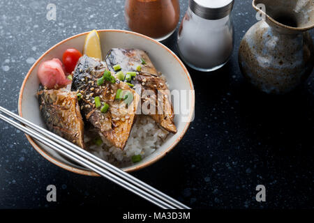 Saba mackerel fish grill with teriyaki sauce on rice in Japanese style. Stock Photo