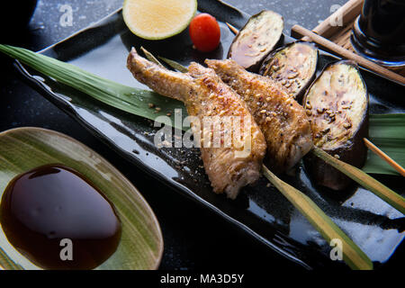 Grill chicken wing with salt seasoning in Japanese skewer grill food style. Stock Photo