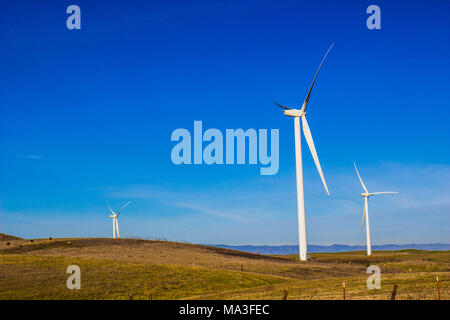 Three Bladed Energy Producing Windmills Stock Photo