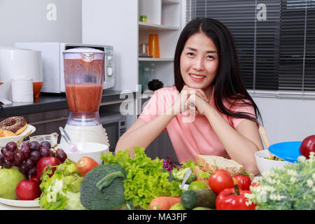 happy young woman cooking in kitchen room