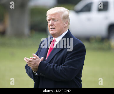 Washington, District of Columbia, USA. 29th Mar, 2018. United States President Donald J. Trump walks on the South Lawn as he departs the White House in Washington, DC for a day trip to Cleveland, Ohio and then on to Mar-a-Lago for the Easter weekend on Thursday, March 29, 2018.Credit: Ron Sachs/CNP Credit: Ron Sachs/CNP/ZUMA Wire/Alamy Live News
