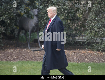 Washington, District of Columbia, USA. 29th Mar, 2018. United States President Donald J. Trump walks on the South Lawn as he departs the White House in Washington, DC for a day trip to Cleveland, Ohio and then on to Mar-a-Lago for the Easter weekend on Thursday, March 29, 2018.Credit: Ron Sachs/CNP Credit: Ron Sachs/CNP/ZUMA Wire/Alamy Live News