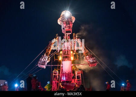 Geevor, Cornwall, UK. 29th March 2018. The Man Engine, the largest mechanical puppet ever constructed in the UK seen here at the mines at Geevor on the north west Cornish coast on an icy cold evening.   The Ressurection tour starts this Easter Saturday in Cornwall at Geevor, with a narrative around the rich mining history of Cornwall.  The man engines creator is Will Coleman of Golden Tree productions. Credit: Simon Maycock/Alamy Live News Stock Photo