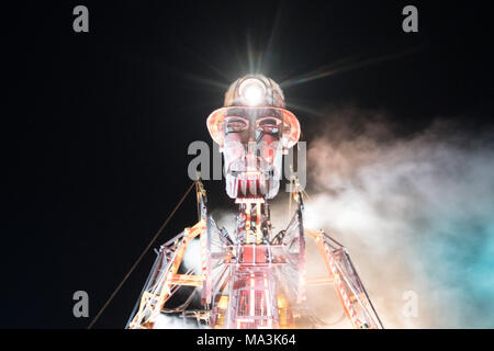 Geevor, Cornwall, UK. 29th March 2018. The Man Engine, the largest mechanical puppet ever constructed in the UK seen here at the mines at Geevor on the north west Cornish coast on an icy cold evening.   The Ressurection tour starts this Easter Saturday in Cornwall at Geevor, with a narrative around the rich mining history of Cornwall.  The man engines creator is Will Coleman of Golden Tree productions. Credit: Simon Maycock/Alamy Live News Stock Photo