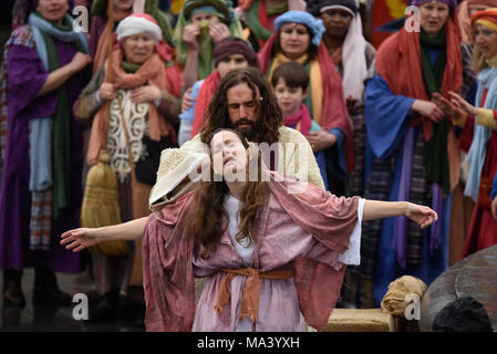 For Easter Good Friday the cast of Wintershall CIO portrayed the ‘Passion’ and the resurrection of Jesus Christ using Trafalgar Square as a stage. Christ is played by James Burke-Dunsmore, taking the crowd through the story from the ‘miracles’, last supper and penultimately the crucifixion, before rising again. Jesus cleansing a leper Stock Photo