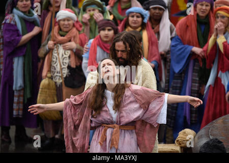 For Easter Good Friday the cast of Wintershall CIO portrayed the ‘Passion’ and the resurrection of Jesus Christ using Trafalgar Square as a stage. Christ is played by James Burke-Dunsmore, taking the crowd through the story from the ‘miracles’, last supper and penultimately the crucifixion, before rising again. Jesus cleansing a leper Stock Photo