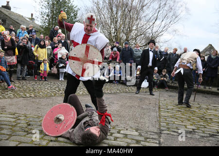 Heptonstall, UK. 30th March, 2018. The Heptonstall Players entertain with the annual traditional Pace Egg Play taking place throughout Good Friday in the historical village of Heptonstall, 30th March, 2018 (C)Barbara Cook/Alamy Live News Stock Photo