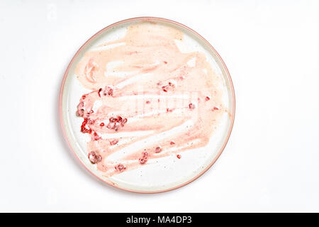 Top view of dirty plate with ice cream stains and fat Stock Photo