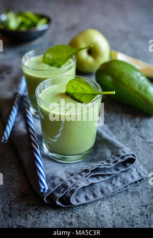 Healthy avocado, spinach and apple smoothie in glass jars Stock Photo