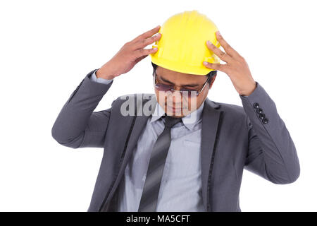 engineer in suit with headache and problems isolated on a white background Stock Photo