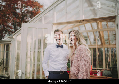 Happy bridal couple, laughing outside, half portrait, Stock Photo