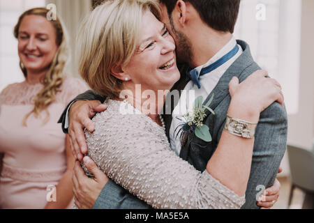 Wedding, groom and senior woman, hug, smile, Stock Photo