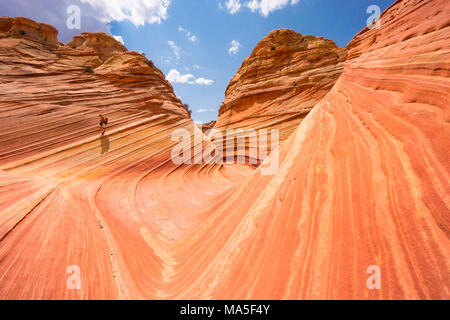 Walking at the Wave, Coyote Buttes North, Colorado Plateau, Arizona, USA Stock Photo