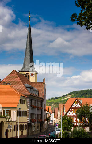 Typical franconian houses and parish church Saint Johannes Baptist in Margetshöchheim at the Main river, Main valley, Franconia, Bavaria, Germany Stock Photo
