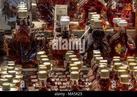 QUEBEC, CANADA - DECEMBER 26, 2016: Maple Syrup bottles for sale on Quebec city market. Quebec is the highest producer of Maple syrup in the world, a  Stock Photo