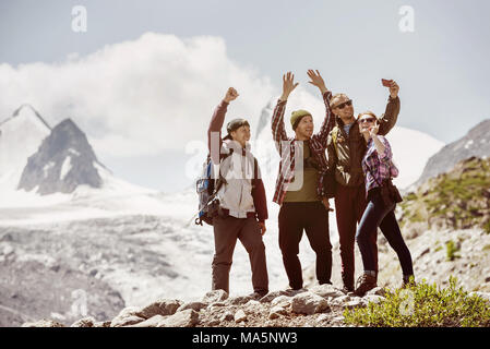 Group happy friends makes selfie mountains adventure expedition Stock Photo