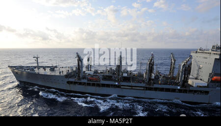 180329-N-VK310-0001 PHILIPPINE SEA (March 29, 2018) The amphibious assault ship USS Wasp (LHD 1) conducts a replenishment-at-sea with the fleet replenishment oiler USNS Tippecanoe (T-AO 199). Wasp, part of the Wasp Expeditionary Strike Group, with embarked 31st Marine Expeditionary Unit, is operating in the Indo-Pacific region to enhance interoperability with partners, serve as a ready-response force for any type of contingency and advance the Up-Gunned ESG concept. (U.S. Navy photo by Mass Communication Specialist 3rd Class Michael Molina/Released) Stock Photo