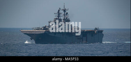 180329-N-BD308-0003 PHILIPPINE SEA (March 29, 2018) The Wasp-class amphibious assault ship USS Bonhomme Richard (LHD 6) transits the Philippine Sea prior to conducting a replenishment-at-sea with the fleet replenishment oiler USNS Tippecanoe (T-AO 199). Bonhomme Richard, along with the Wasp Expeditionary Strike Group, with embarked 31st Marine Expeditionary Unit, is operating in the Indo-Pacific region to enhance interoperability with partners, serve as a ready-response force for any type of contingency and advance the Up-Gunned ESG Concept. (U.S. Navy photo by Mass Communication Specialist 3r Stock Photo