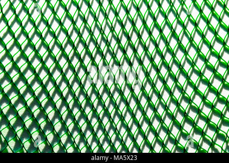 Green net casting the big shadow on the white soft background surface Stock Photo