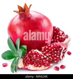Ripe pomegranate fruits with pomegranate leaves on the white background. Stock Photo
