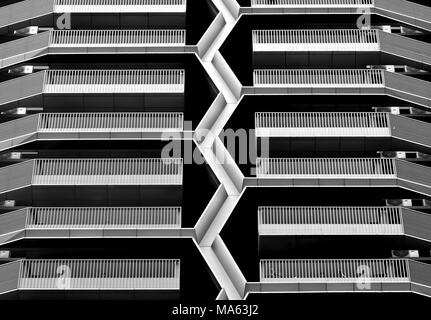 Front view of abstract geometric design of a modern multi-story car park in  the Financial District, Singapore with strong symmetry and bold geometry Stock Photo