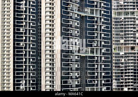 Front view of an enormous modern public housing apartment tower in Singapore with strong detail of design and architectural elements Stock Photo