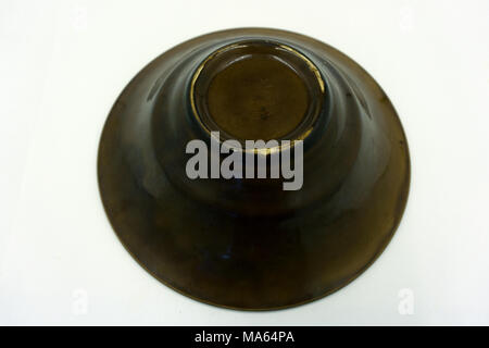 Empty black soup plate on dark grey background, top view Stock Photo
