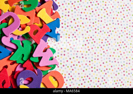 colourful alphabet letters and polka dots background Stock Photo