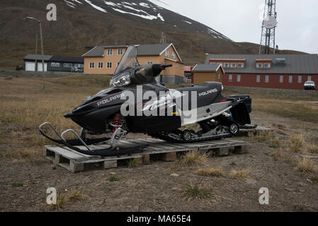 As snow covers the Svalbard archipelago in the Arctic Ocean nearly nine months a year snowmobile are a very common mode of transportation. Stock Photo