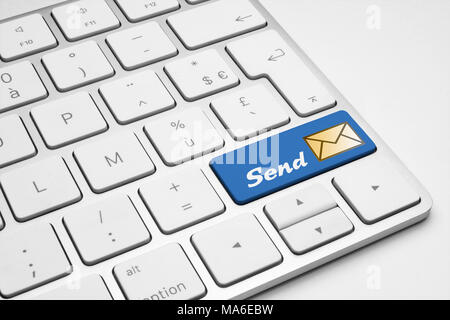 Send blue button with a mail icon on a white isolated keyboard - internet, web, social media and business illustrative concept. Stock Photo