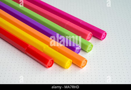 Colorful of Color Pens on White with Dot Backgound Stock Photo