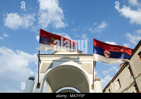 Prohor Pcinjski,Serbia,September 02, 2016:   tower with cross and serbian flags.Monastery of  Prohor Pcinjski is one of the oldest Serbian Monasteries Stock Photo